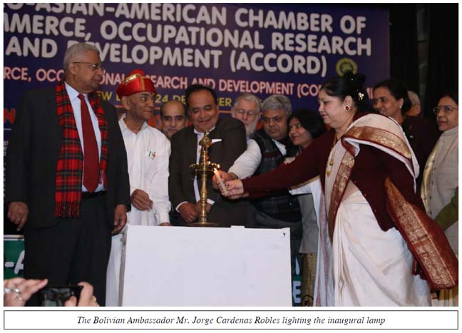 The Bolivian Ambassador Mr. Jorge Cardenas Robles lighting the inaugural lamp