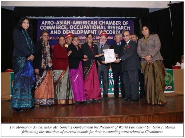 The Mongolian Ambassador Mr. Gonchig Ganbold and the President of World Parliament Dr. Glen T. Martin felicitating the Awardees of selected schools for their outstanding work related to Cleanliness